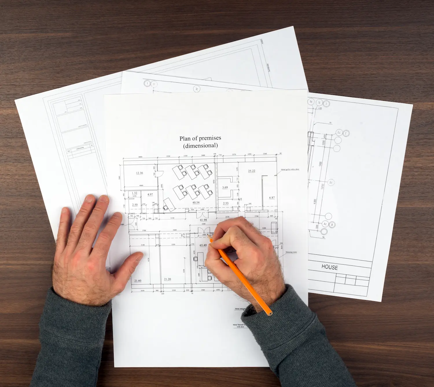 mans-hands-drawing-drafts-on-wooden-table-2025-10-16-13-44-39-utc.webp